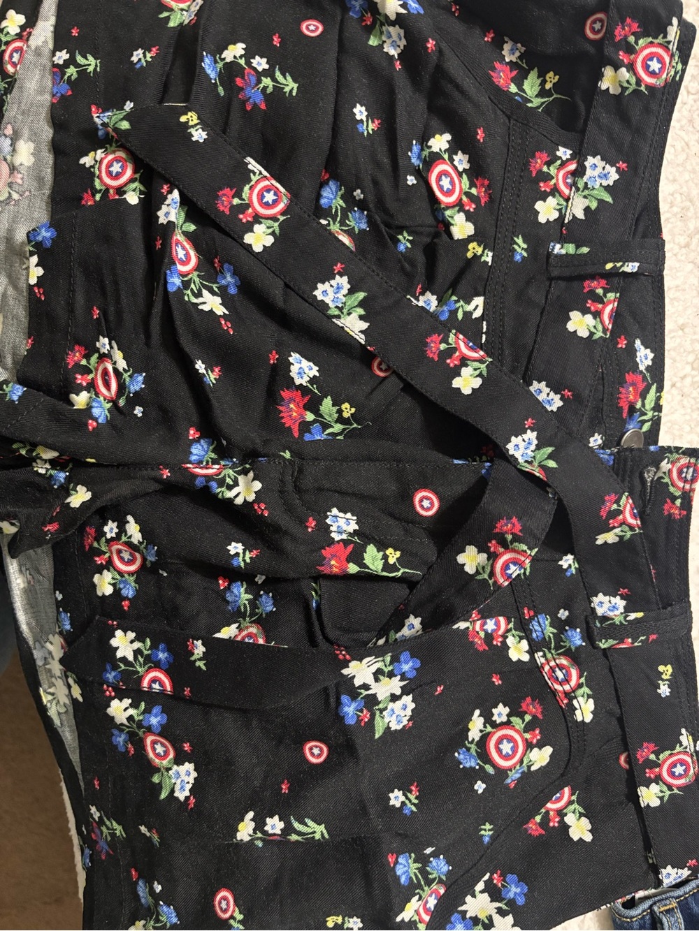 Her Universe Captain America Black Floral Shorts with shields.